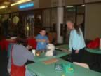 Vicky McLaughlin helping a young man build pipe cleaner dogs at the kid's activity table. (37kb)